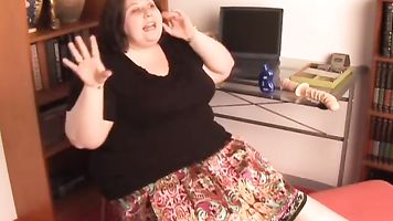 Hot CHUBBY brunette talks dirty and gets her tits out